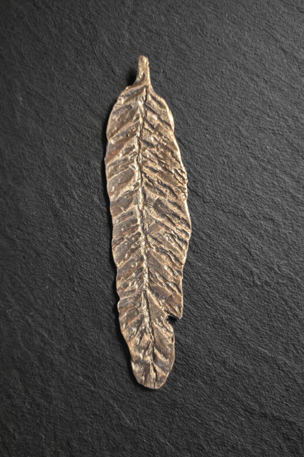 Hand forged steel feather